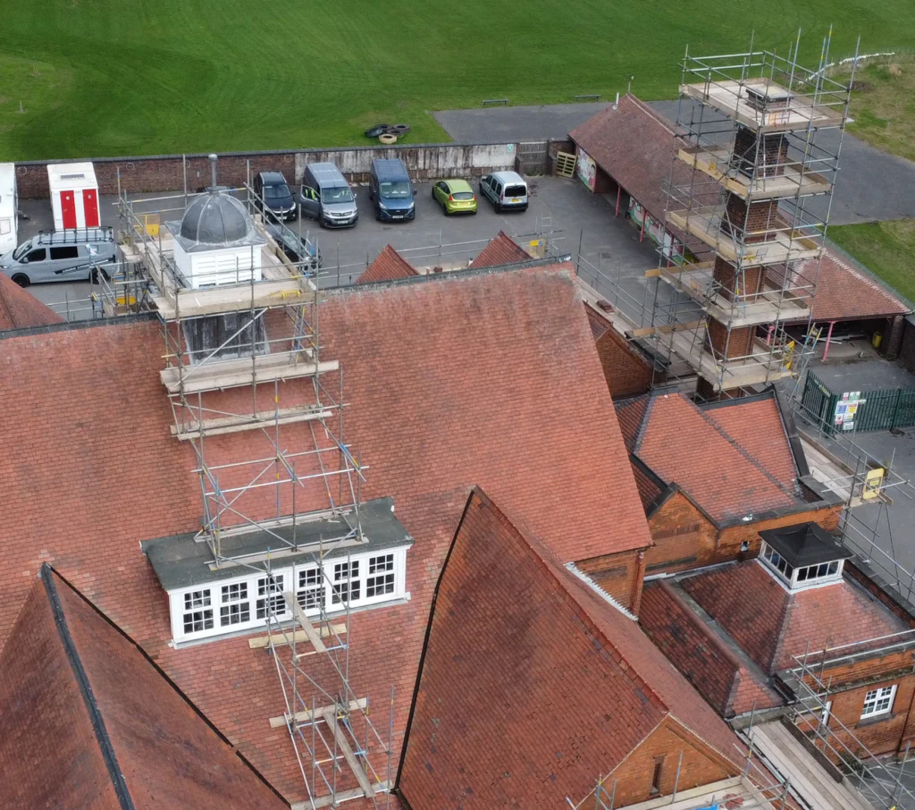 Scaffolding on the belltower and chimney at  a Victorian school building by Anton Scaffolding